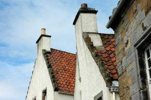 Red roof line on a white building