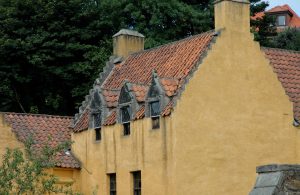Red roof line on a gold building